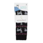 Black alpaca socks with an alpaca pattern in Winterborn packaging