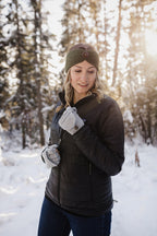 Woman in the snow wearing a knit alpaca headband